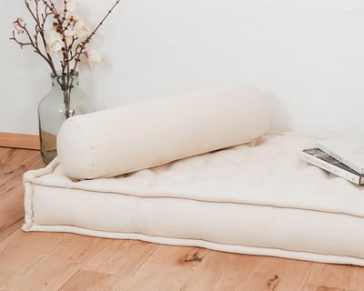 wool bolster pillow on a wool mattress