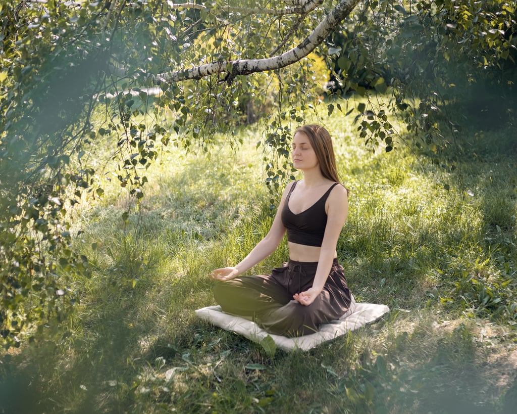 girl meditated in the park on wool meditation cushion