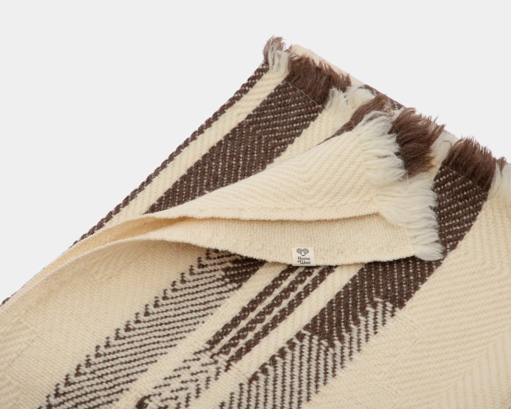 folded heavy wool blanket detail on white background