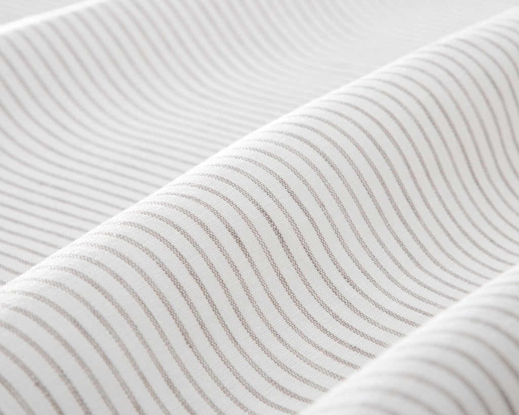 linen fabric with thin grey stripes close up