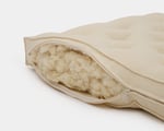 crib mattress unzipped showing 100% Organic Wool Filling