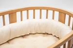 home of wool bed snake pillow in a crib