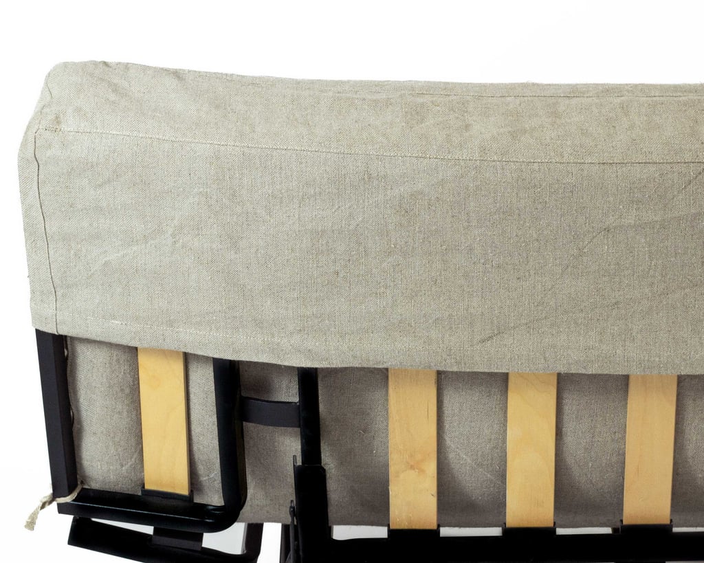 wool futon mattress on a sofa from the rear, showing how it attaches