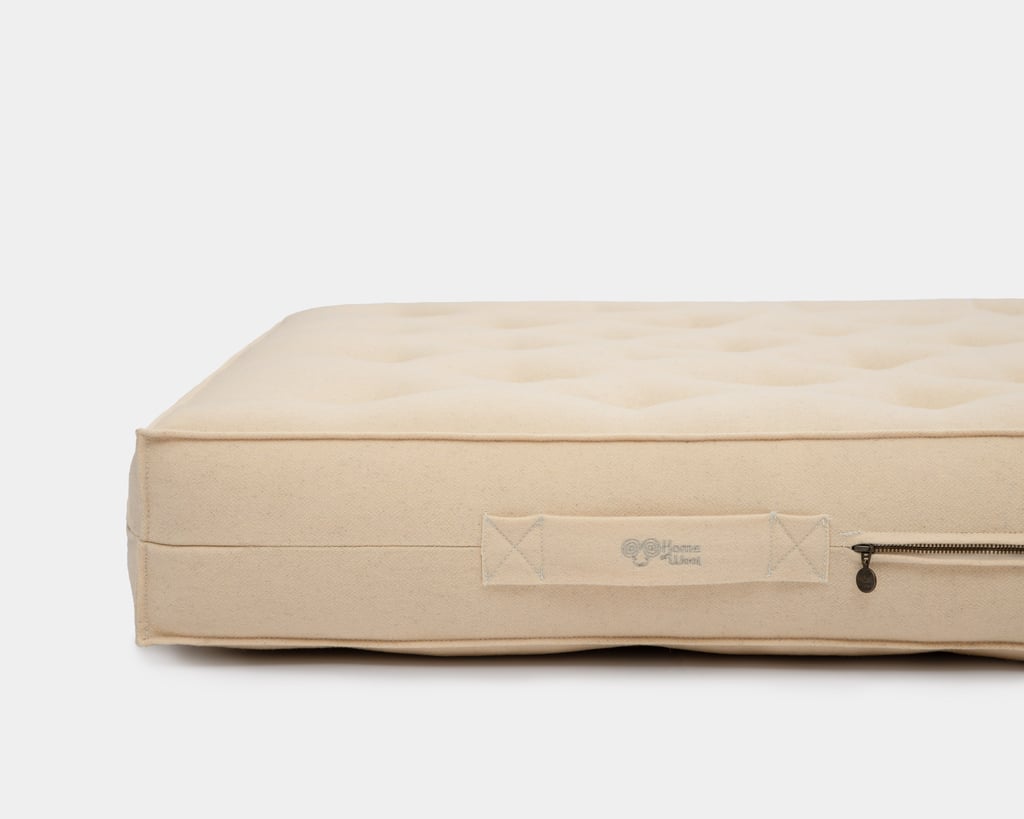 close up of wool mattress in 100% virgin wool fabric with mini piping design