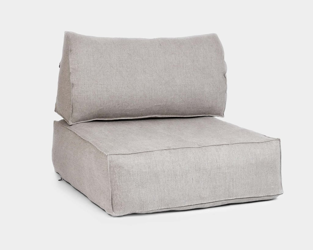 Triangular wool back cushion on a futon