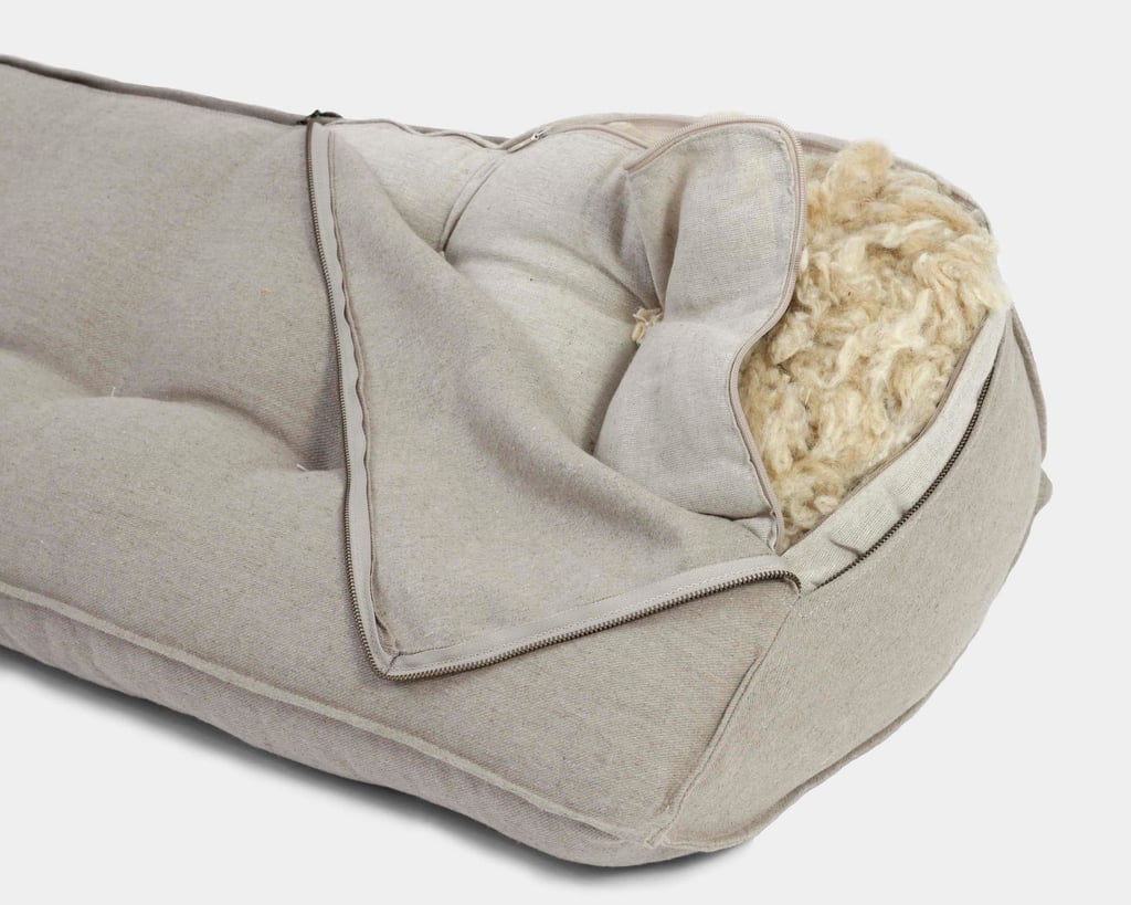 Wool triangular back cushion from linen, showing wool filling