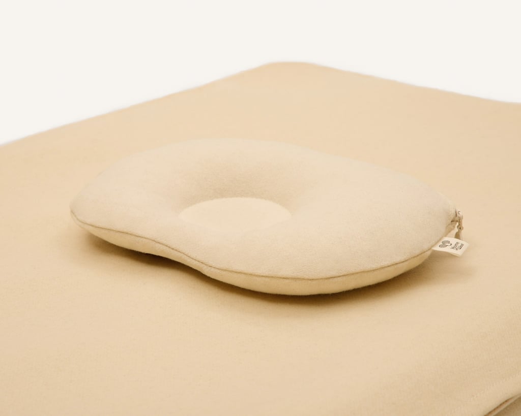 wool baby pillow close up showing zipper and home of wool tag