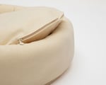 close up of round wool dog bed showing the zipper