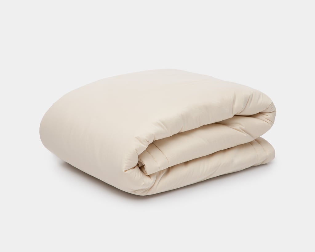 couples wool duvet folded on a white background. Big wool duvet.