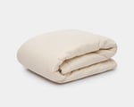 couples wool duvet folded on a white background. Big wool duvet.