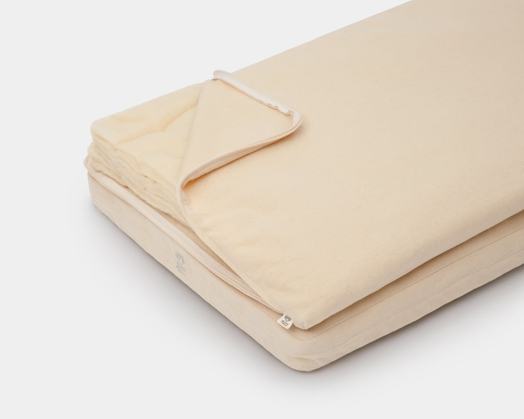 home of wool crib mattress topper with wool batting showing