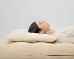 wool thin pillow with a woman sleeping on it, on her back