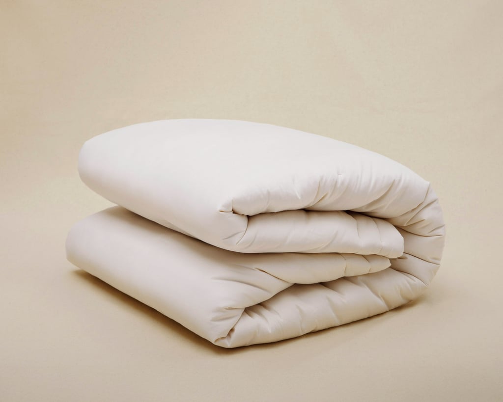 hem av ull täcke vikta