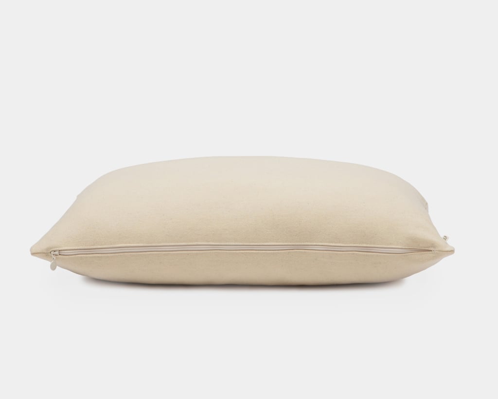 wool pillow protector on a pillow on a white background