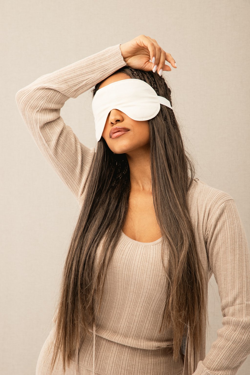 girl with sleeping mask on her eyes