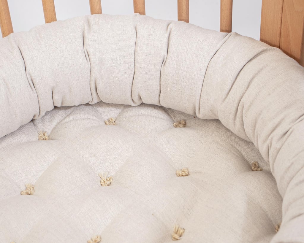 home of wool bed snake pillow in a crib