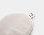 detail of sleeping mask with logo home of wool with