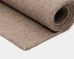 rolled up wool rug close up