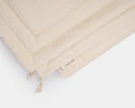 couples wool duvet folded on a white background. detail