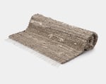 zero waste linen rug rolled up