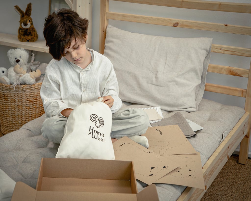 boy unboxing home of wool diy stuffed animals