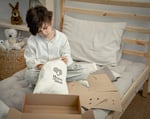boy unboxing home of wool diy stuffed animals