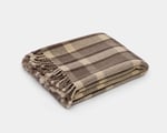 checkered wool blanket folded on white background