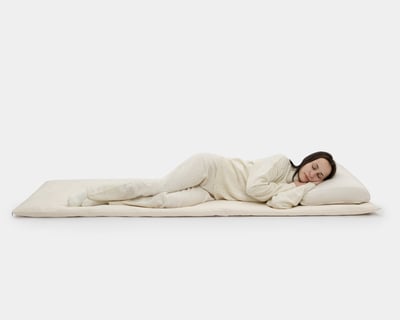 wool floor sleeping mat with person