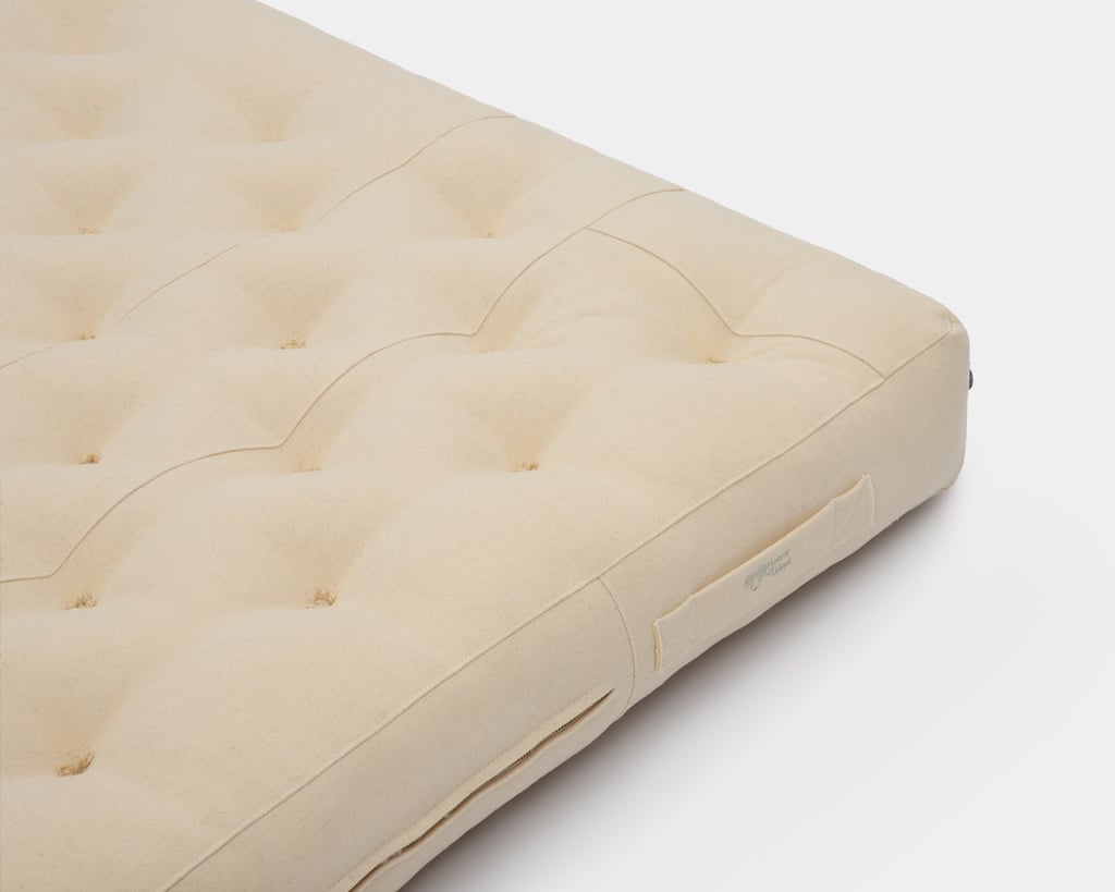 nollajäteinen villapatja vetoketjulla ja tupsuilla