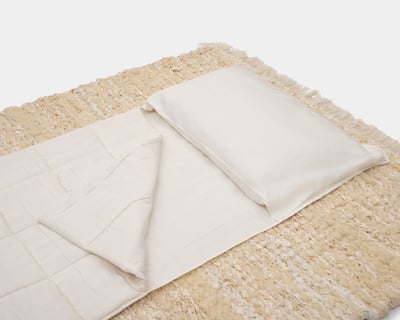 home of wool travel bedding set on handwoven rug