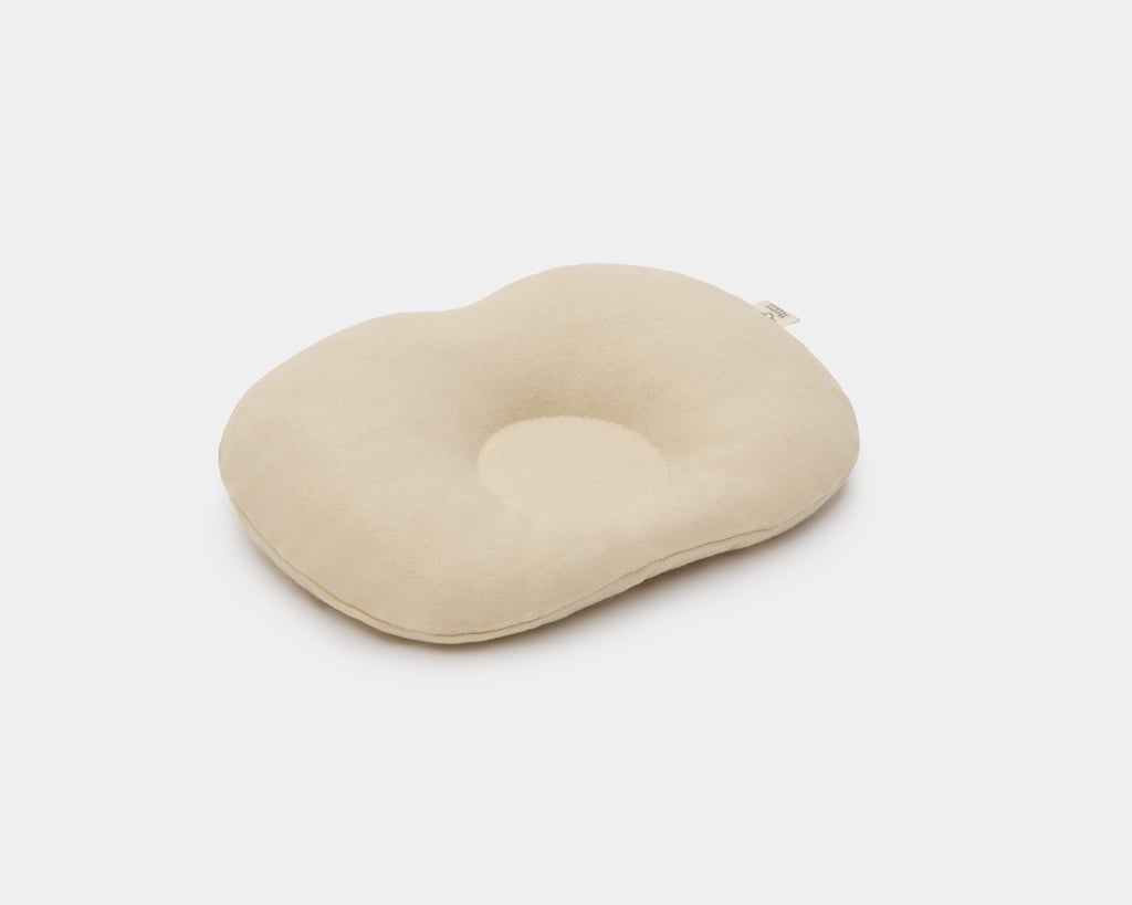 wool baby pillow against a white background