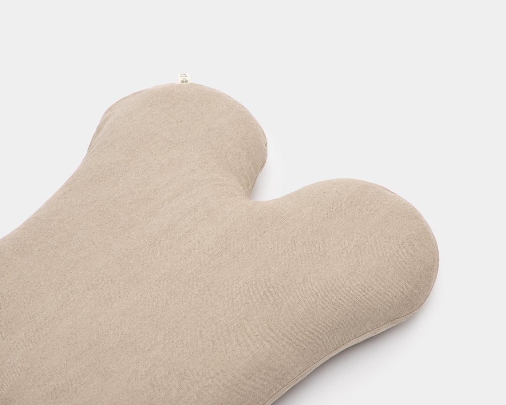 wool dog bed shaped like a bone close up