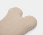 wool dog bed shaped like a bone close up