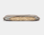 wool dog bed shaped like a bone unzipped