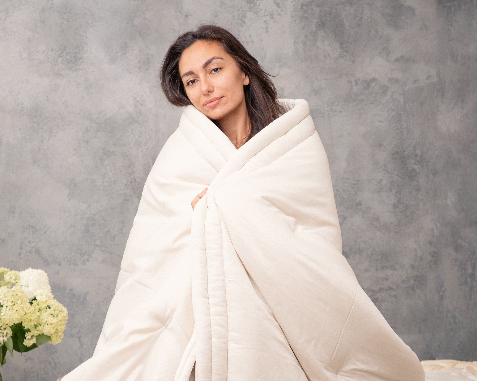 Wool duvet insert with a woman covering herself