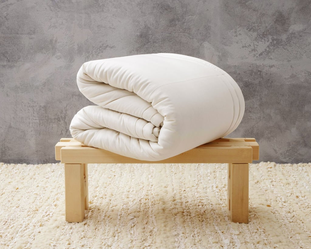 wool duvet insert folded and on a bench