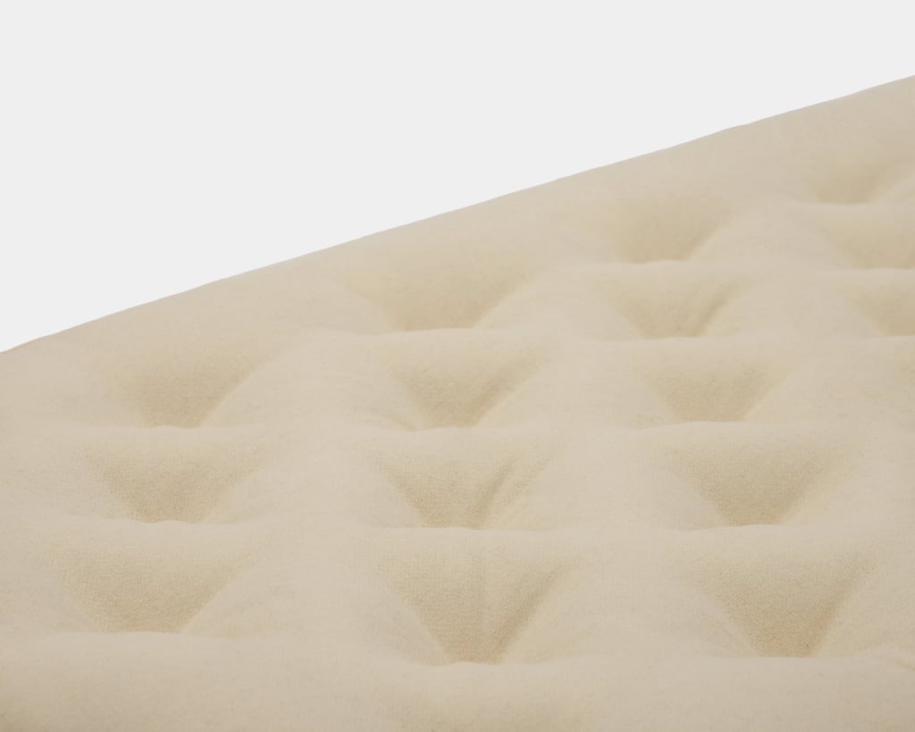 detail of tufting for wool crib mattress