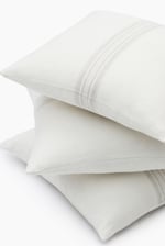 Wool throw pillows stacked