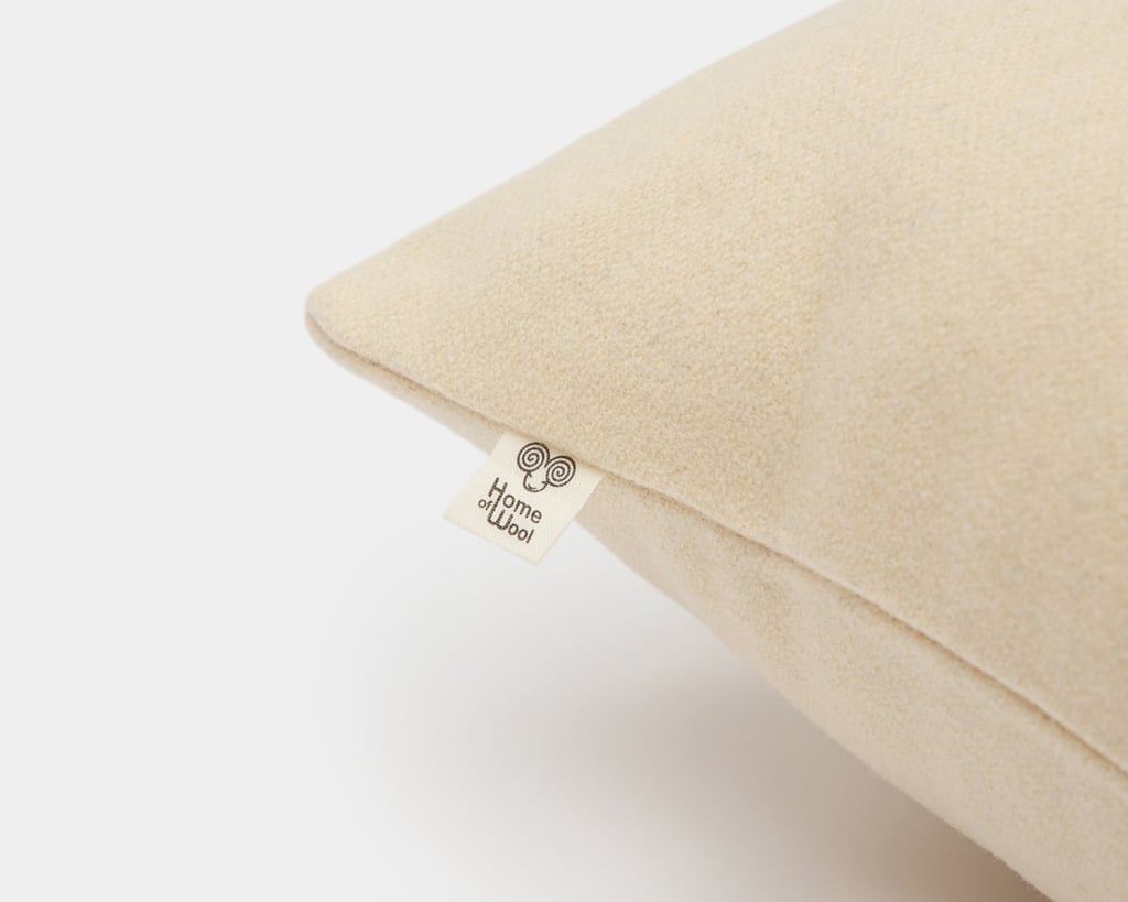 wool pillow protector on a pillow on a white background