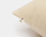 wool pillow protector on a pillow on a white background