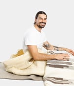 trek pro sleeping bag with a person sitting in it