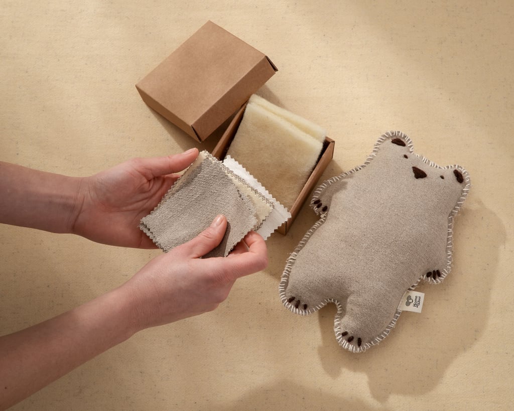 Montessori fabrics box with fabrics held by hands