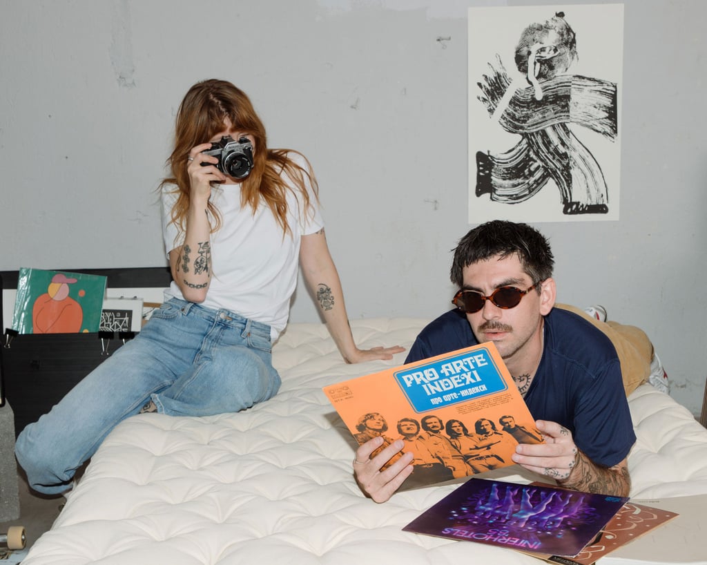 girl and a boy sitting on wool top mattress
