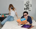 girl and a boy sitting on wool top mattress