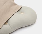 wool dog bed shaped like a bone close up unzipped fabric