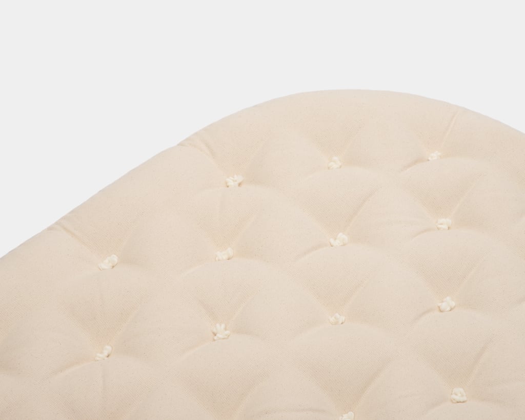 close up of stokke crib wool mattress for kids