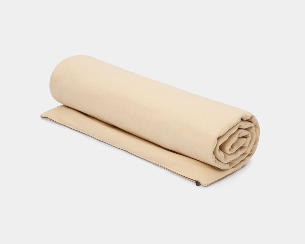 wool floor sleeping mat rolled up