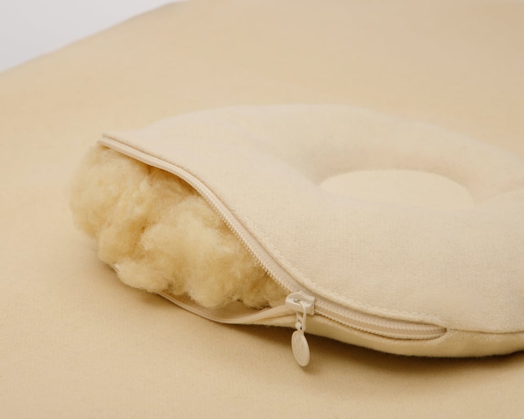 unzipped wool baby pillow showing wool filling