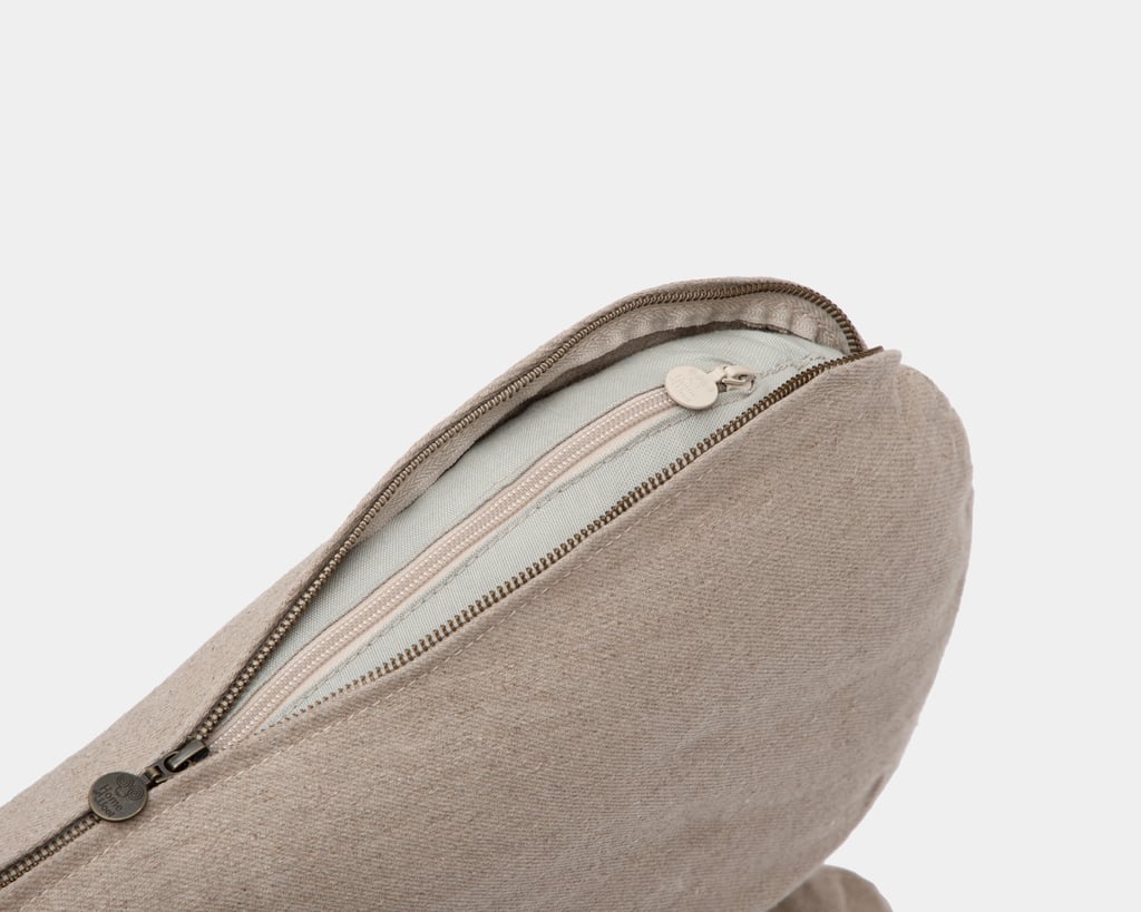 wool dog bed shaped like a bone closeup of zipper