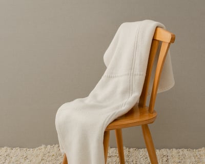 Grid Knit Wool Blanket on a chair